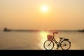 Silhouette women`s style bike at sunset on seascape with bridge and cloud sky. Vector illustration design Royalty Free Stock Photo