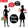 Silhouette of women with shopping bags,Black Friday sign and lab