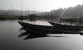 Silhouette reflection wooden boats dock in Rawa Pening Rawapening lake in the morning