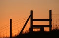 Silhouette of wooden stile at sunset Royalty Free Stock Photo