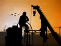 Silhouette worker on construction site over Blurred construction