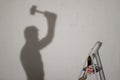 Silhouette of a worker with the hammer