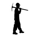 silhouette of a worker holding his mattock tool.