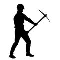 silhouette of a worker swinging his mattock tool.
