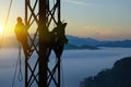 Silhouette workers on background of construction crews to work on high ground heavy industry and safety concept. Construction of Royalty Free Stock Photo