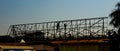 Silhouette workers for the roof building in construction site