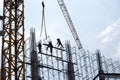 Silhouette of workers on top of building construction site Royalty Free Stock Photo