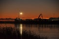 Silhouettes of industrial port on sunset Royalty Free Stock Photo