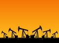 Silhouette of working oil pumps