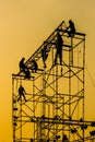 Silhouette of Workmen on assembling concert stage Royalty Free Stock Photo