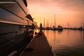 Silhouette Yacht boat with beautiful sun sky background. The vintage style yacht boat at marina harbor.