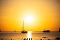 Silhouette Yacht boat sailing boats or Travel boats in Beautiful phuket sea at sunset golden sky Amazing for summer holiday