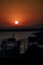 Silhouette of yachts at sunset in the harbor. Sunset over the sea. Fishing boats in the port. Boats in the bay at sunset Royalty Free Stock Photo