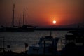 Silhouette of yachts at sunset in the harbor. Sunset over the sea. Fishing boats in the port. Boats in the bay at sunset Royalty Free Stock Photo