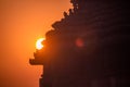 Silhouette of ancient hindu temple as the sun rays emerge from behind. Sun Temple, Konark, Odissha (Orissa), India