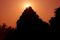 Silhouette of an Hindu temple as the sun rays emerge from behind. Sun Temple, Konark, Odissha (Orissa), India. UNESCO