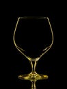 Silhouette of yellow whiskey glass with clipping path on black background