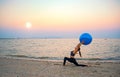 Silhouette yoga ball yung woman in the beach sunset Royalty Free Stock Photo