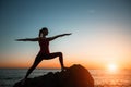 Silhouette of yoga woman doing exercise on the sea beach Royalty Free Stock Photo