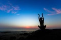 Silhouette of yoga woman doing exercises on the ocean beach Royalty Free Stock Photo