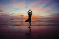 Silhouette of Yoga woman meditation near the ocean beach. Royalty Free Stock Photo