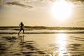 Silhouette of young Asian sport runner woman in running workout Royalty Free Stock Photo