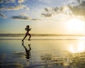 Silhouette of young Asian sport runner woman in running workout Royalty Free Stock Photo