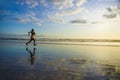 Silhouette of young Asian sport runner woman in running workout Royalty Free Stock Photo