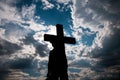 Silhouette of a young boy and a catholic cross Royalty Free Stock Photo