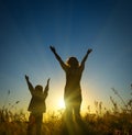 Silhouette of a young boy and his mother