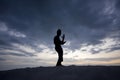 Silhouette of young boy performing a pencak silat Royalty Free Stock Photo