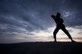 Silhouette of young boy performing a pencak silat Royalty Free Stock Photo