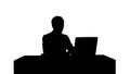 Silhouette Young businessman concentrating on working with laptop computer Royalty Free Stock Photo