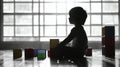A silhouette of a young child sitting on the floor in front of a large grid window, surrounded by colorful toy blocks