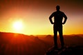 Silhouette of Young Confident and Powerful Man Standing with Hands on Hips, Morning Or Late Day Sun with Copy Space Royalty Free Stock Photo