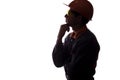 Silhouette of a young constructer thinking of a career, a man in a helmet on a white isolated background