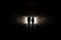 Silhouette of young couple holding hands Royalty Free Stock Photo