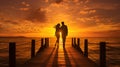 Silhouette of a young couple in love walking along the pier towards the sunset against the backdrop of the sea, clouds and flying Royalty Free Stock Photo