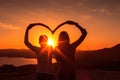 Silhouette of young couple making heart shape with hands at sunset, A couple forming a heart shape with their hands at sunset, AI Royalty Free Stock Photo