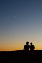 Silhouette of a young couple at sunset Royalty Free Stock Photo