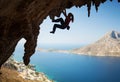 Silhouette of young female rock climber on a cliff Royalty Free Stock Photo