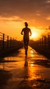 A silhouette of a young fitness enthusiast jogging against a stunning sunrise