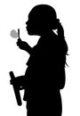 A Silhouette of a young girl blowing bubbles Royalty Free Stock Photo