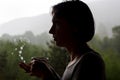 Silhouette of a young girl with a cup of tea Royalty Free Stock Photo