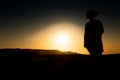 Silhouette of young girl with sunset in Namibe Desert. Africa. Angola Royalty Free Stock Photo