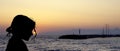 Silhouette of a young girl with sunset over in Gouves, Crete Royalty Free Stock Photo