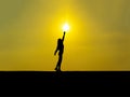 Silhouette-young girl touching the sun at sunset Royalty Free Stock Photo