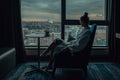 Silhouette of a young girl in a white bathrobe which drinking her morning tea and looking throw the hotel window Royalty Free Stock Photo