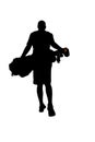 Silhouette of young golfer walking away with golf bag Royalty Free Stock Photo