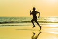 Silhouette of young happy and attractive African American runner woman exercising in running fitness sprint workout at beautiful b Royalty Free Stock Photo